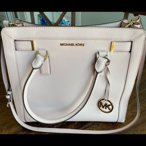 Pink Michael Kors purse. It’s in excellent condition.